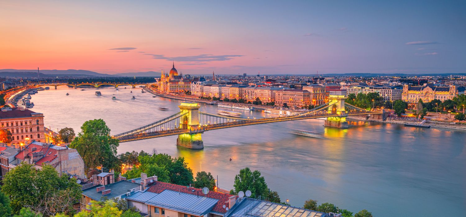 Aerial cityscape image of Budapest panorama with Chain Bridge and parliament building during summer sunset, Hungary