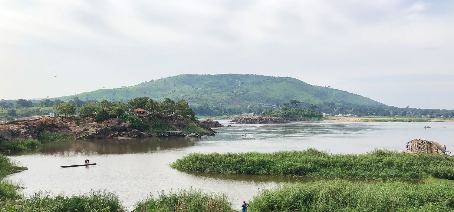 View of the Oubangui River in Bangui, Central African Republic, with boats and fishermen.